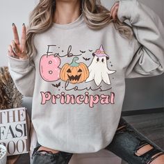 Fun halloween sweatshirts for an elementary principal. Cute fall sweatshirt for women. Perfect halloween party shirt. Spooky season sweatshirt. Carved Halloween Pumpkin. Halloween gifts for teachers. 》 》FEATURES《 《  Sweatshirt & Hoodie | Gildan - Unisex Size - 50% Cotton 50% Polyester  Wash on cold & hang to dry for best results  All items run true to size. Refer to size guide listing photo to determine the most accurate fit  Women can size down for a fitted style    》 》PRODUCTION AND SHIPPING《 Fall School Hoodie With Letter Print, Long Sleeve Fall Sweatshirt For School, Cartoon Print Long Sleeve Sweatshirt For School, Long Sleeve Fun Hoodie For Fall, Fun Long Sleeve Hoodie For Fall, Halloween Gifts For Teachers, Elementary Principal, Perfect Halloween Party, Assistant Principal