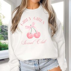 Hey there, Girly Girls Social Club member! Are you ready to cozy up in style with a touch of feminine flair? Introducing our "Girly Girls Social Club" Sweatshirt – the perfect blend of comfort and chic for every girly girl out there! Crafted from premium fleece fabric, this sweatshirt feels like a warm hug on a chilly day. The playful "Girly Girls" graphic adds a pop of personality to your wardrobe, celebrating your love for all things fabulous and fun. Whether you're cuddled up on the couch with a rom-com marathon or heading out for a shopping spree with your besties, our sweatshirt is your go-to choice for casual glam. Its relaxed fit ensures you stay comfortable and stylish, no matter where your day takes you. From brunch dates to movie nights, this sweatshirt is as versatile as it is t Long Sleeve Graphic Sweater, Trendy Crew Neck Sweater, Cozy Letter Print Tops For Spring, Cozy Letter Print Sweater For Spring, Cozy Spring Sweater With Letter Print, Cozy Graphic Print Sweatshirt For Spring, Cozy Graphic Print Tops For Spring, Chic Cotton Sweatshirt For Spring, Chic Spring Cotton Sweatshirt