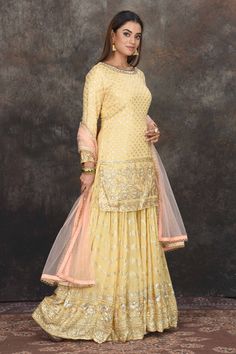 Look beautiful on festive occasions in this lemon yellow embroidered sharara suit. It comes with a peach dupatta. Suits Sharara, Yellow Sharara, Peach Dupatta, Embroidered Sharara, Designer Lehengas, Sharara Suit, Bridal Lehengas, Fashion Journals, Traditional Fabric