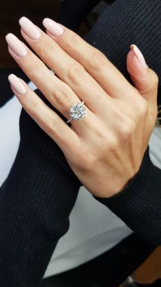 a woman's hand with a ring on it