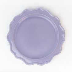 a purple plate sitting on top of a white table