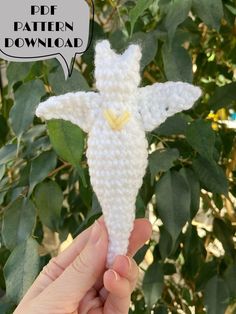 a crocheted angel ornament with a speech bubble above it