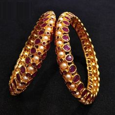 Ruby Kundan Kada / Reverse Polki Bangles / Ruby Pearl bangles / Indian Wedding Jewelry with semi-precious Ruby Stones @AryaFashions * Beautiful designer Gold tone Kundan bangles * Beautiful Jadau Bangle set with high quality Pearl and Meenakari work. * The base metal color is Gold tone studded with ruby accent semi precious stones on it. * Pair of two Bangles * Suitable for any occasion and attire * Comes in sizes 2.4,2.6 * Ready to ship from Virginia USA. Wedding Jeweled Bangle, Wedding Ruby Bangle In Temple Jewelry Style, Jeweled Bangle For Wedding And Diwali, Ruby Jeweled Bangle For Wedding, Jeweled Bracelets For Wedding And Diwali, Festive Ruby Bangle For Wedding, Temple Jewelry Style Jeweled Bangle For Wedding, Temple Style Jeweled Bangle For Weddings, Fusion Style Openable Bangle For Wedding