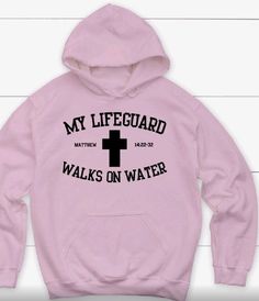 a pink hoodie with the words my lifeguard walks on water printed on it