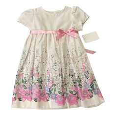 Add A Touch Of Elegance To Your Little One's Wardrobe With This Luli & Me Floral Garden Dress. The Dress Features A Beautiful Bow Accent And A Pleated Fit & Flare Style That Complements Its Knee-Length Design. It Comes In A Multicolor Pattern That Is Perfect For Any Occasion, And The Short Puff Sleeves Make It Ideal For Warm Weather. This Dress Is Perfect For Both Baby Boys And Girls, And It Is Designed To Fit 12-Month-Olds. The Dress Is Brand New And Has Never Been Worn, Making It A Great Addit White Short Sleeve Dress For Dress-up, Spring Floral Print Twirl Dress For Playtime, Summer Princess Dress With Short Sleeves For Dress-up, White Spring Twirl Dress With Short Sleeves, White Princess Dress For Summer Garden Party, Cute Short Sleeve Princess Dress For Spring, Multicolor Fitted Princess Dress For Spring, Spring Multicolor Fitted Princess Dress, Spring Princess Dress For Dress-up Occasions