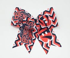 "This Cincinnati Bengals Football Hair Bow is made with high quality 3\" grosgrain ribbon Option for a hair elastic or alligator clip The bow is 7 inches wide and 7 inches long including the tails Great for fans!" Football Hair Bows, Football Hair, Cincinnati Bengals Football, Bengals Football, Hair Elastic, Alexandria Va, Hair Elastics, Cincinnati Bengals, Claw Clip