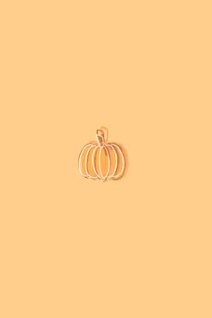 an orange background with a small pumpkin on it