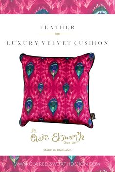 a pink pillow with blue feathers on it and the words, feather luxury velvet cushion