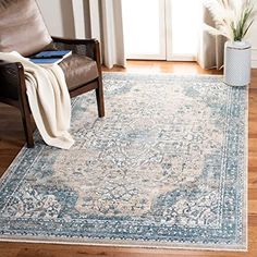 a living room area with a chair and rug