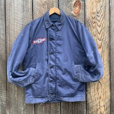 Vintage 60s 70s USN N4 Utility Deck Jacket Blue US Navy Vietnam War Era N7 with Chevy Patches Vintage Blue Pre-washed Outerwear, Retro Pre-washed Outerwear For Fall, Retro Blue Outerwear With Snap Buttons, Vintage Blue Outerwear With Snap Buttons, Navy Vintage Outerwear With Pockets, Vintage Blue Outerwear With Button Closure, Vintage Navy Cotton Outerwear, Vintage Navy Long-sleeve Outerwear, Vintage Navy Long Sleeve Outerwear