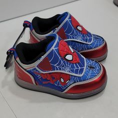 Your Little Spiderman Fan Will Love Running Fast Lighting Up His Soles With Each Step In These Boy's Light-Up Sneakers. With The Velcro Closure And Bungee Laces, This Is An Easy Athletic Shoe For Your Toddler To Put On. And Look At All The Licensed Spiderman Prints All Over The Shoe. Toddler Sizes 7 And 8 Left Non-slip Round Toe Walking Shoes For Jogging, Non-slip Slip-on Skate Shoes For Sports, Red Synthetic Walking Shoes With Round Toe, Non-slip Running Shoes With Round Toe, Non-slip Closed Toe Sneakers For Sports, Non-slip Round Toe Running Shoes, Sporty Scratch-resistant Closed Toe Sneakers, Sporty Scratch-resistant Closed-toe Sneakers, Non-slip Synthetic Sneakers