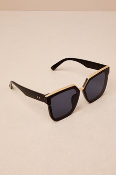 The Lulus Main Frame Black Rimless Sunglasses are our number one pick for make sure you've got that casual-cool style all season long! These semi-rimless sunnies have tinted gradient lenses (with shiny gold accents) and chunky black frames that are sure to make a statement! Frames Measures 5. 75" Long. Arms Measures 5. 5" Long. Man Made Materials. Imported. Lulus | Main Frame Black Rimless Sunglasses. Sleek Gold Sunglasses With Mirrored Lenses, Sleek Gold Sunglasses With Tinted Lenses, Gold Rimless Shield Sunglasses With Polarized Lenses, Sleek Gold Sunglasses For Summer, Gold Polarized Shield Sunglasses For Beach, Gold Shield Sunglasses With Polarized Lenses For Beach, Aesthetic Sunglasses, Hexagon Sunglasses, Chic Sunglasses