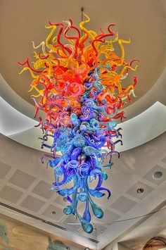 a multi colored chandelier hanging from the ceiling