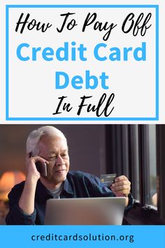 an older man sitting in front of a laptop computer while holding a credit card