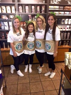 three girls in starbucks outfits posing for the camera