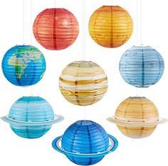 six paper lanterns hanging from strings in different colors and sizes, with the planet on each string