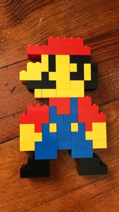 a lego figure made to look like an old school video game character is on the floor