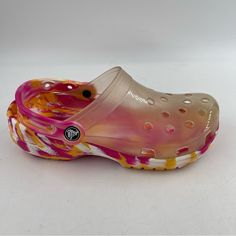 New With Tags Size 7 Women’s Crocs Women’s Orange Pink White Classic Translucent Marbled Clog Mule Shoes. Please See Photos For All Details Of Shoes Unisex Crocs Classic Clog. This Iconic, Lightweight Clog Will Be Your Go-To Comfort Shoe. Just Slip It On And Go! The Super Lightweight Design With Cool Ventilation Ports Will Keep You Feeling Great Through The Day. Lightweight, Water Friendly Man Made Uppers Ventilation Ports For Added Breathability And Helps Allow Water To Drain Slip-On With Pivot Summer Clogs With Translucent Outsole, Trendy Pink Clogs For Spring, Trendy Pink Spring Clogs, Trendy Pink Clogs For The Beach, Pink Casual Clogs For Summer, Casual Pink Non-slip Clogs, Casual Pink Slip-on Clogs, Casual Pink Round Toe Clogs, Pink Round Toe Clogs For Spring