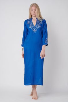 this ocean blue gallabia dress embroided in silver cord is the summer beach look with small sleeves and open 27 cm v neck sexy and suitable for summer 125 cm length embroidery over the v neck, sleeves and back - great look! Embroidered V-neck Dress, Blue Long Sleeve V-neck Dress For Vacation, Blue Bohemian Embroidered Dress For Festive Season, V-neck Embroidered Dress With Resham For Eid, V-neck Floral Embroidered Dress For Eid, Elegant V-neck Kurta For Summer, Long Sleeve Floral Embroidery Dress For Beach Cover-up, Long Sleeve Dresses With Floral Embroidery For Beach, Eid V-neck Dress With Resham Embroidery