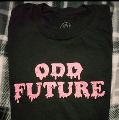 Brand New W/O Tag Tried On But Never Worn Black Odd Future Shirt By Tyler The Creator Size M Unisex Black Slogan Shirt For Spring, Black Edgy Shirt With Text Print, Cool Black Tops With Letter Print, Edgy Black Shirt With Text Print, Edgy Black Shirt With Letter Print, Black Slogan Shirt In Grunge Style, Black Shirt With Text Print For Spring, Grunge Cotton Shirt With Slogan, Edgy Cotton Shirt With Text Print