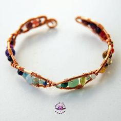 One of a kind Boho Gemstone Rainbow Bracelet  - A unique colourful multi gemstone wire wrapped bracelet - handcrafted with heart from the Beaux Artisan Gems by Black Lotus London Collection. ❤︎ Classic Rainbow-hued multi gem cuff bangle❤︎ Flexible cuff style for adjustability❤︎ Dainty 0.25-inch width adorned with assorted gemstones for a bright and bold lookChoose from copper (pictured), gold or silver plated wire work - with optional upgrade to 925 Sterling Silver on request for an additional p Multicolor Bangle With Natural Stones As A Gift, Hand Wrapped Wrap Bracelet Bangle For Friendship, Gift Multicolor Bangle With Natural Stones, Hand Wrapped Bangle Wrap Bracelet For Friendship, Adjustable Beaded Bracelets With Stones, Artisan Wire Wrapped Adjustable Bracelets, Adjustable Multicolor Spiritual Cuff Bracelet, Adjustable Hand Wrapped Bracelets, Wearable Art, Adjustable Hand Wrapped Bracelet In Wearable Art Style