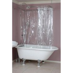 a bath tub sitting next to a toilet under a window covered in clear shower curtain