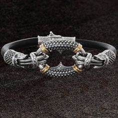 The uniquely styled SILVER AND GOLD RINGLET Bracelet for Men from Konstantino combines rugged black leather with the finest sterling silver and 18k gold to offer a design that combines the best of both. The solid silver ring is carved with small circular rivets that shine against an oxidized backdrop. Accents of brilliant 18k gold and signature Konstantino engravings in the silver add that extra touch of classic style. Size: 8 1/2 inches long and 7/8 inch at its widest point. Material: 925 Sterl Saint Bracelet, Mens Chains, Mens Sterling Silver Jewelry, Mens Sterling Silver Bracelets, Vegas Nightlife, Cool Rings For Men, Mens Designer Jewelry, Mens Beaded Necklaces, Steampunk Leather