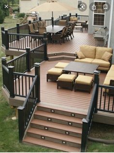 an outdoor deck with seating and umbrellas