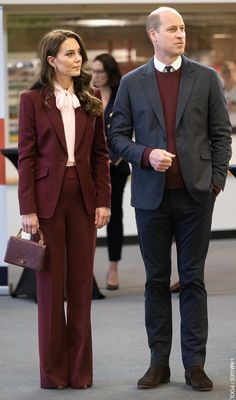 a man and woman dressed in business attire