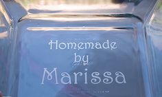 a clear glass vase with the words homemade by marissa written in white on it