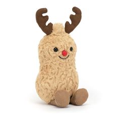 a small stuffed animal with antlers on it's head and legs sitting down