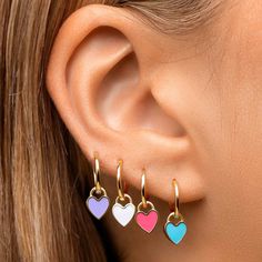 These solid gold huggies are the perfect beginner earring. We love these layered for an extra bold look. Tiny Heart Earrings, Gold Huggies, Heart Earring, Pink Enamel, Tiny Heart, Enamel Charms, Green Enamel, Black Enamel, Heart Earrings