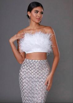 Glamorous Skirt With Feather Trim For Night Out, Glamorous Party Skirt With Feather Trim, Glamorous White Sequined Crop Top, White Strapless Crop Top For Party, Party Fitted Skirt With Feather Trim, Fitted Skirt With Feather Trim For Night Out, White Glamorous Tube Top For Night Out, Glamorous White Tube Top For Night Out, Feather Crop Top