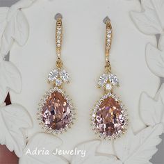 Matching Bracelet: https://www.etsy.com/listing/640920653/blush-crystal-wedding-bracelet-pink?ref=shop_home_active_1 Material: Swarovski vintage rose crystals, clear cubic zirconia paved findings, high quality gold plated brass settings. Necklace Size: Pear crystal with settings is 1.6cm*1.4cm. Necklace is adjustable from 41cm to 46cm. Please leave a message if you want different length. Earrings size: Full length 4cm, 1.4cm wide. Teardrop dangles are 1.6cm*1.4cm. Metal Color: Available in Rose Pink Diamond Earrings With Accents For Wedding, Pink Diamond Earrings With Diamond Accents For Wedding, Pink Diamond Earrings With Prong Setting For Wedding, Pink Teardrop Diamond Earrings, Pink Teardrop Earrings With Prong Setting, Pink Diamond Teardrop Earrings, Elegant Pink Diamond Earrings For Anniversary, Rose Gold Crystal Earrings For Anniversary, Rose Gold Diamond Crystal Earrings For Wedding