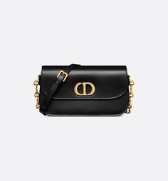 The 30 Montaigne Avenue bag enhances the hallmark line with a timeless and elegant style. Crafted in black box calfskin, the rounded flap with delicate curves is punctuated by a gold-finish metal CD clasp inspired by the seal of a Christian Dior perfume bottle. The design is completed by other details, like the 30 Montaigne signature embossed on the back and the signature chain alternating gold-finish metal and tonal enamel links that match the leather. The gusseted bag features a spacious and r Dior Perfume Bottle, Christian Dior Perfume, Womens Designer Bags, Dior Book Tote, Christian Dior Couture, Luxury Designer Handbags, Boutique Online, Black Box, Lady Dior