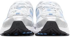 Low-top mesh sneakers in white. Faux-leather overlays in blue, white, and reflective silver-tone throughout. Round toe. Tonal lace-up closure. Logo printed in white at padded tongue. Padded collar. Rubberized logo appliqué in blue and silver-tone at sides. Grosgrain pull-loop in blue at heel collar. Rubberized logo appliqué in silver-tone at ABZORB® foam rubber midsole in blue and white. Treaded rubber outsole in black, white, and blue. Tonal hardware.Supplier color: White/Light blue New Balance For Men, New Balance White, New Balance Outfit, Luxury Streetwear, Air Jordan Sneaker, Blue And Silver, New Balance, Sneakers Nike, Light Blue