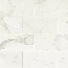 white marble tiles with grey veining on the edges and bottom, all lined up in rows