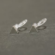 Invisible Clip On Earrings , Silver Triangle Clip On Stud Earrings Geometric Non Pierced Earrings 🌟More pierced look and comfortable invisible clip on earrings are available at MiyabiGrace home page. Please click the link below https://www.etsy.com/shop/MiyabiGrace 🌟More minimal and feminine invisible clip on earrings. https://www.etsy.com/shop/MiyabiGrace/items?show_panel=true&search_query=tiny+invisible Details ◆Length:0.15 inches (0.4 cm) ◆Weight:1 g (0.04 oz) ◆Color: Silver ✨These are Non Pierced Earrings, Earrings Geometric, Earrings Stud, Earring Findings, Pierced Earrings, Earrings Silver, Earings Piercings, Clip On, Home Page