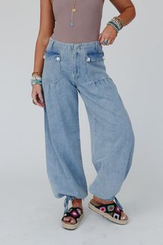 So cozy and cool, you're never going to want to take the First Things First Wide Leg Jeans off - Elevate your boho wardrobe with these these stylish and chic statement pants! Comfortable washed denim fabric Relaxed and loose wide leg silhouette Flattering mid - rise waistline with a classic button - zipper front closure and back elastic waistband So cute front patch pockets with button flaps, belt loops, and pleated details Unique drawstring ankle closures (can be worn as wide legs or jogger sty Denim Bottoms For Fall Festivals, Bohemian Medium Wash Jeans For Fall, Bohemian Medium Wash Denim Pants, Denim Blue Bohemian Relaxed Fit Pants, Bohemian Style Relaxed Fit Denim Blue Pants, Dark Wash Stonewashed Bottoms For Spring, Medium Wash Cargo Jeans For Summer, Spring Dark Wash Stonewashed Bottoms, Bohemian Dark Wash Bottoms For Spring