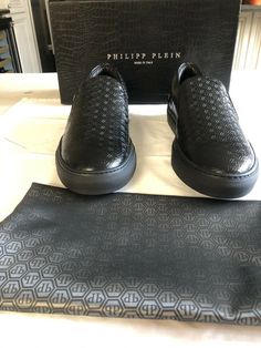 Philipp Plein mens shoes. Condition is New with box. New with box and dust bag Never worn Limited Edition mens Black PP logo slip on shoes with PP silver metal logo on the back of shoes Made in Italy Size 43.5 Designer Slip-on Sneakers With Branded Insole, Luxury Slip-on Sneakers With Perforated Toe Box, Designer Low-top Loafers With Leather Sole, Designer Leather Slip-on Shoes With Rubber Sole, Designer Slip-on Leather Shoes, Luxury Slip-on Low-top Leather Shoes, Luxury Calf Leather Slip-on Sneakers, Luxury Low-top Leather Shoes With Textured Sole, Designer Sneakers With Branded Insole