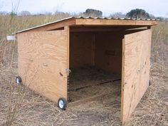 an outhouse with hay in the middle of it's floor and roof is shown