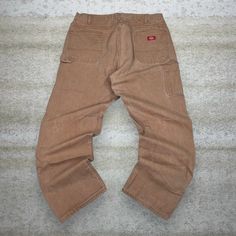 Vintage Dickies Carpenter Pants Camel Tan Canvas Baggy Fit Dungarees Work Wear Painters 90s Skate / Streetwear Great Condition: 9/10 Men's Size:  Waist: 40" Length (inseam): 32" Leg Opening: 9" Thigh Opening: 14" Front Rise: 15" 90s Oversized Wide Leg Bottoms, 90s Style Oversized Wide Leg Bottoms, Oversized Wide Leg 90s Bottoms, Vintage Baggy Khaki Bottoms, Baggy Vintage Khaki Bottoms, Oversized Brown Bottoms With Pockets, Vintage Oversized Straight Leg Bottoms, Casual Brown Work Pants With Belt Loops, 90s Style Bottoms With Pockets For Fall