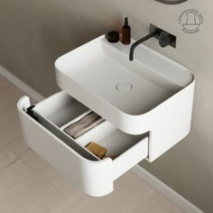 a bathroom sink with an open drawer underneath it