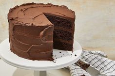 a chocolate cake with one slice missing from it