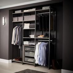 an organized closet with clothes and shoes