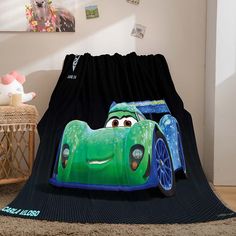 a blanket that has a car on it