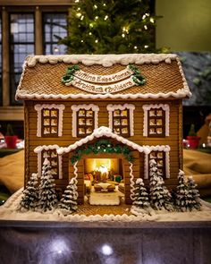 a gingerbread house is decorated for christmas