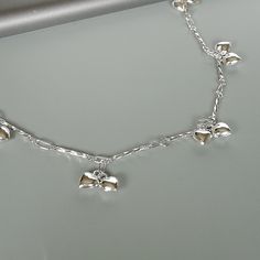 Sterling silver speciality chain anklet. Comes with tiny puffed heart charms. Also ends with a tiny bell. Length: 10 inches. Hearts : 5 x 6 mm Bell: 7mm Price listed is for ONE piece. These anklets are made of 925 hypoallergenic sterling silver. All my pieces are sent in a gift box. I can include a personal message from you if needed. You are welcome to contact me at... bhavnakwintra1956@gmail.com For more beautiful pieces from my shop, please browse 👇 TOE RINGS: https://www.etsy.com/your/shops Silver Anklet With Delicate Chain As Gift, Silver Delicate Chain Anklet As Gift, Silver Delicate Chain Anklet For Gift, Delicate Silver Anklet As A Gift, Elegant Silver Anklets With Heart Charm, Silver Heart-shaped Anklets As Gift, Silver Adjustable Chain Anklets In Metal, Silver Adjustable Chain Metal Anklet, Silver Anklets With Adjustable Chain