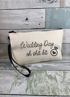 the wedding day survival kit is sitting on top of a wooden table next to a wall