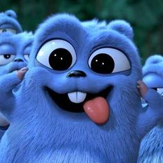 a group of blue furry animals standing next to each other with their tongue hanging out